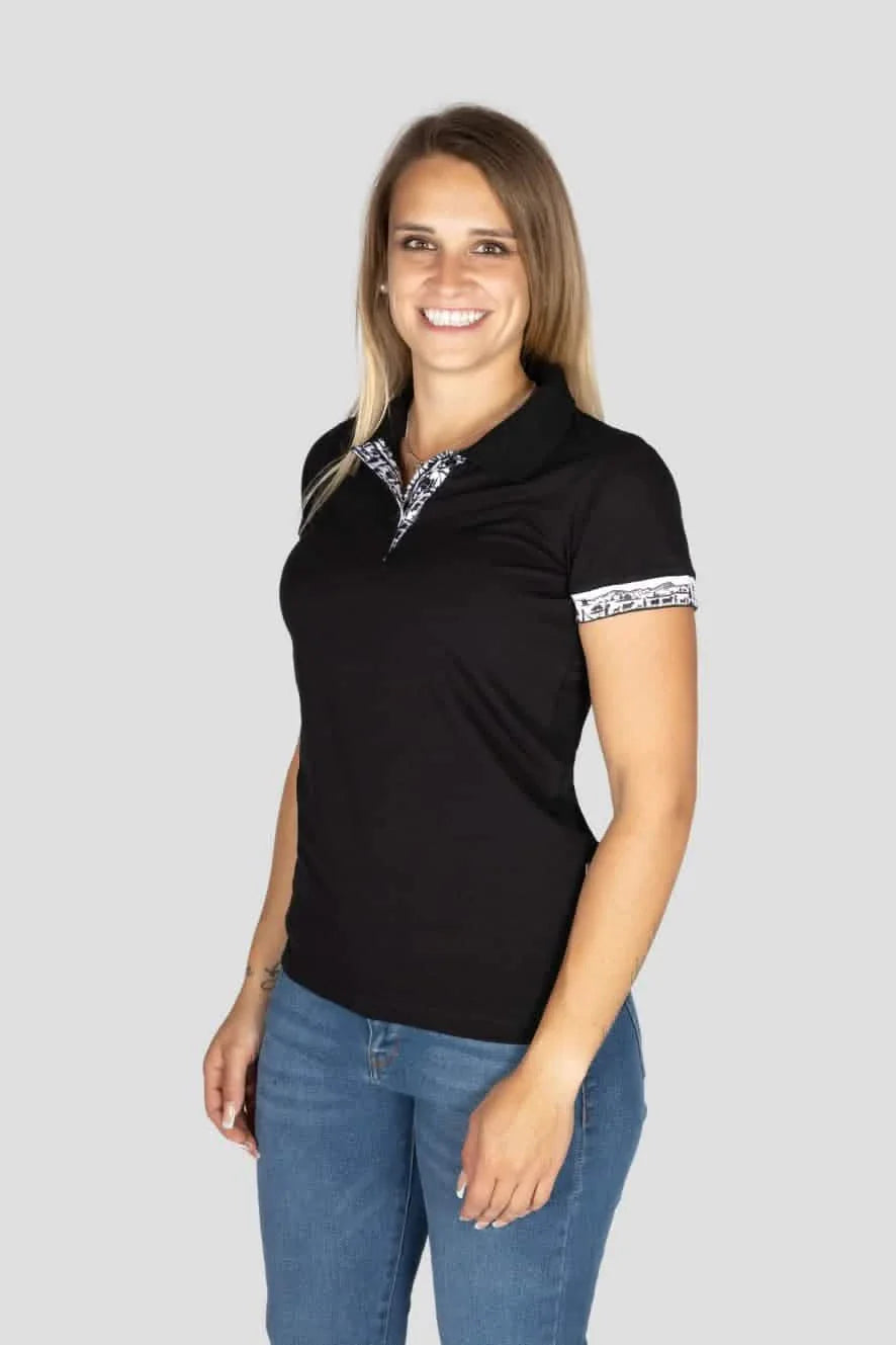 Damen Scherenschnitt Polo-Shirt von Edelvetica, gekennzeichnet durch einzigartige Scherenschnitt-Details am Kragen und den Armabschlüssen. Dieses elegante Polo-Shirt verbindet traditionelle Schweizer Kunst mit modernem Stil und bietet eine stilvolle Option für diverse Anlässe. Perfekt für eine anspruchsvolle Garderobe, die traditionelle Elemente und zeitgenössische Mode vereint.